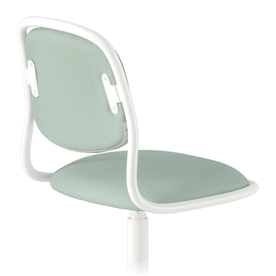 A white-framed childrens desk chair with a light green mesh seat and backrest. The chair is ergonomically designed and looks sturdy.