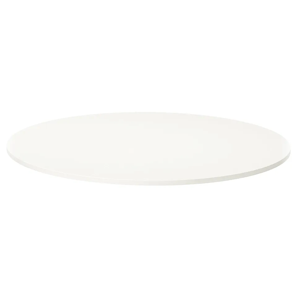 A round, white VIHALS table with a minimalist design. It has a smooth melamine surface and sleek edges, suitable for modern spaces.