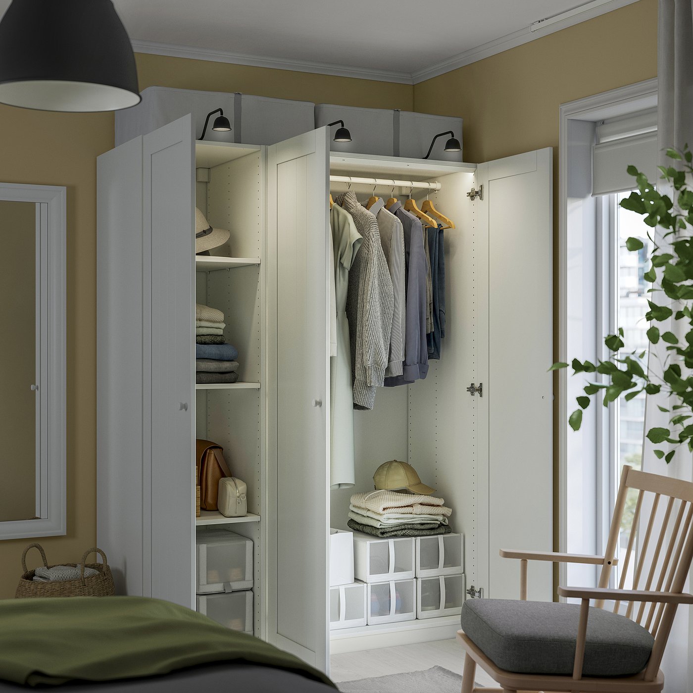 Cosy bedroom with PAX closet, neatly organised. Green blanket on bed, rocker with cushion, large window for natural light.