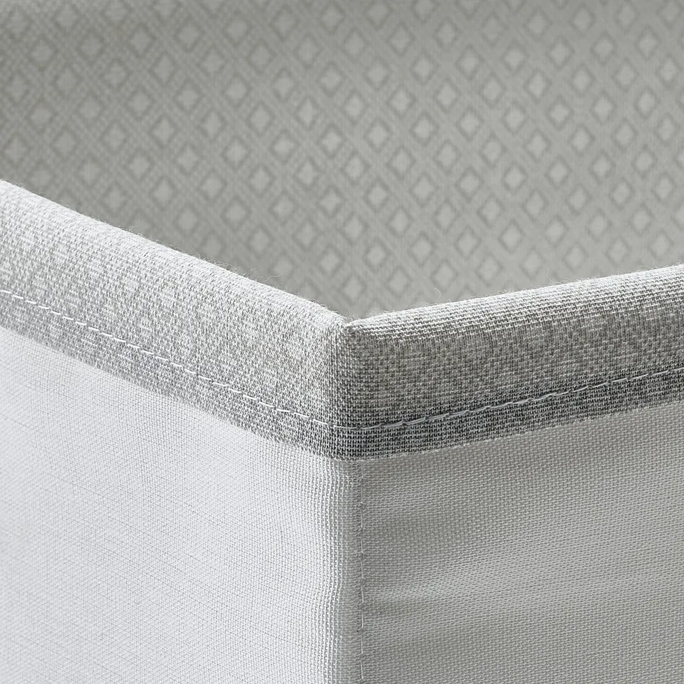 BAXNA white fabric organiser corner, recycled polyester, structured design.