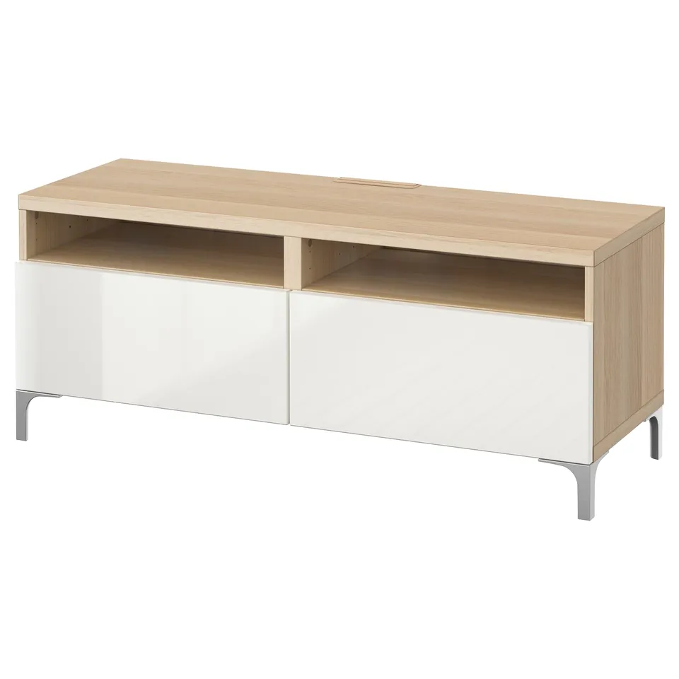 Modern tv stand, BESTÅ. Light-colored wood top, white lower drawers, four metal legs. Open storage, cable management.