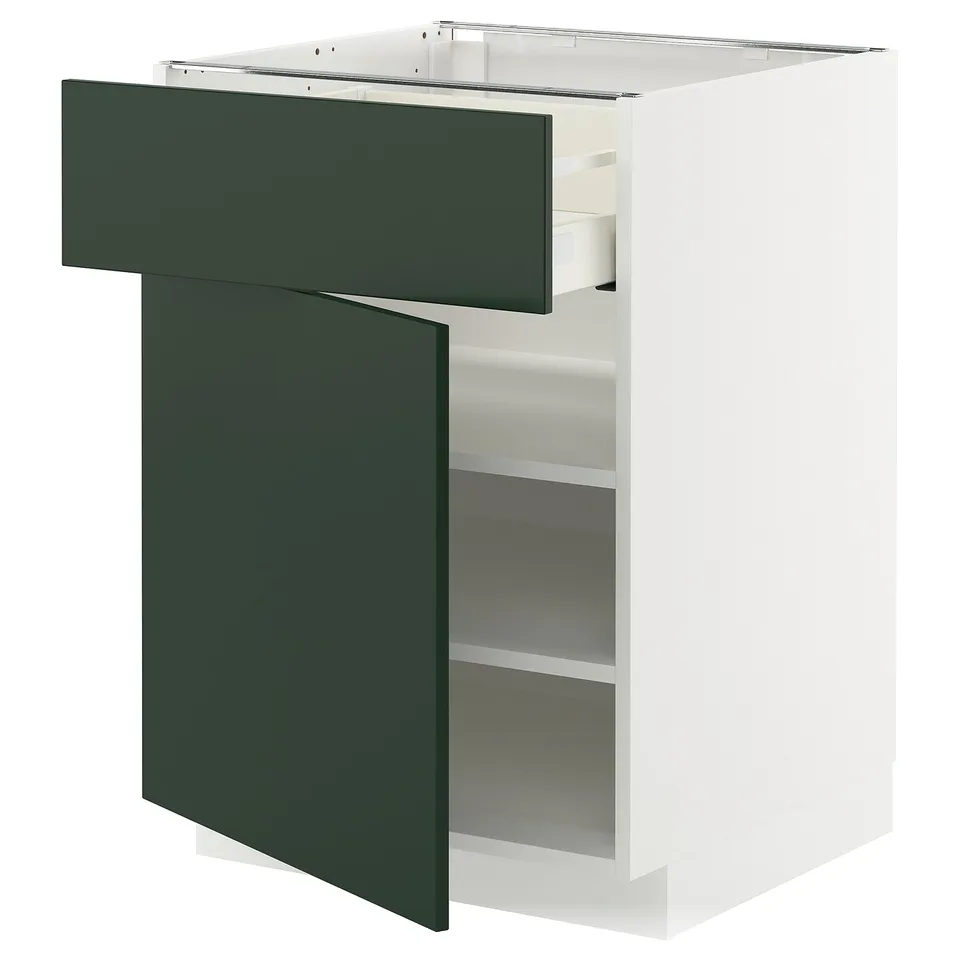 White METOD cabinet with green havstorp drawer and door open.