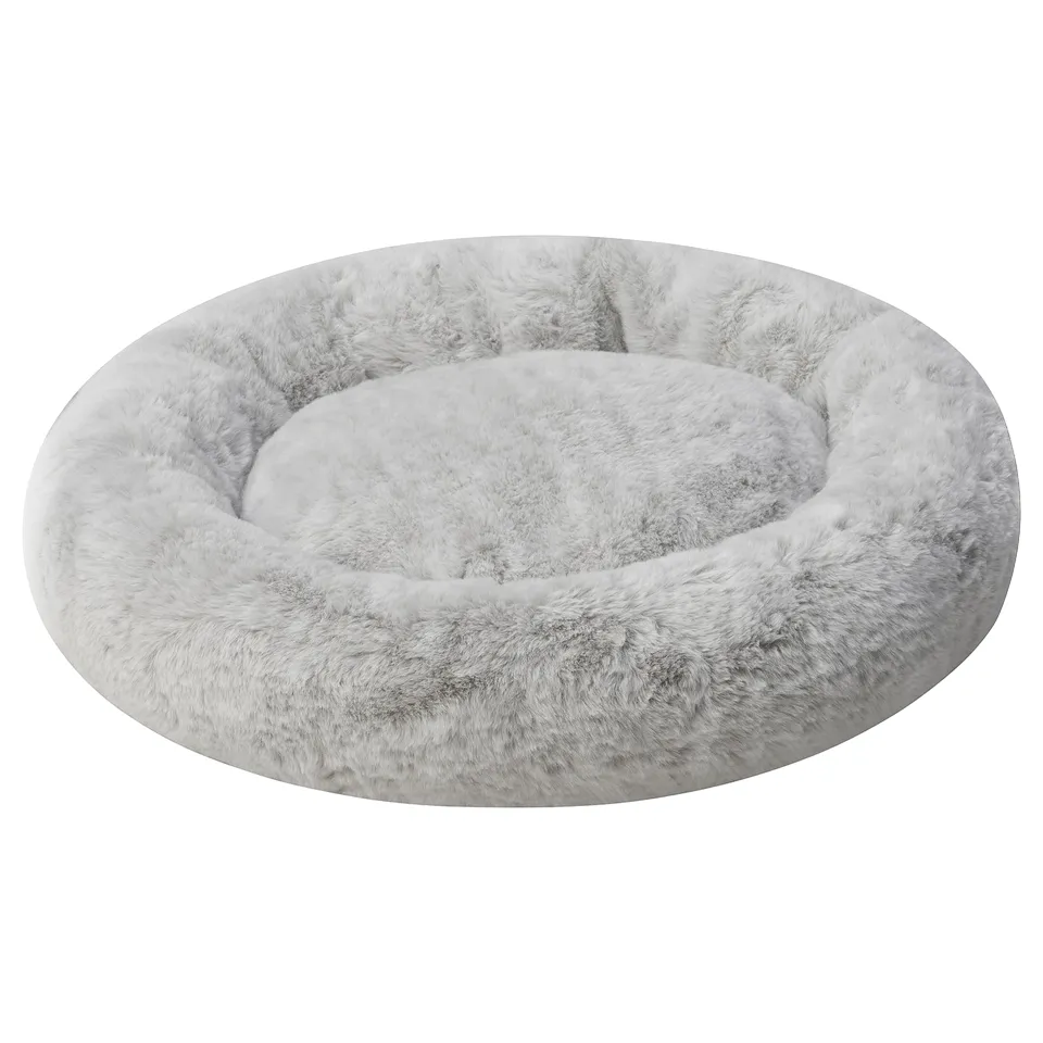 A round, soft pet bed UTSÅDD with high edge, anti-slip bottom, cushioned for comfort.