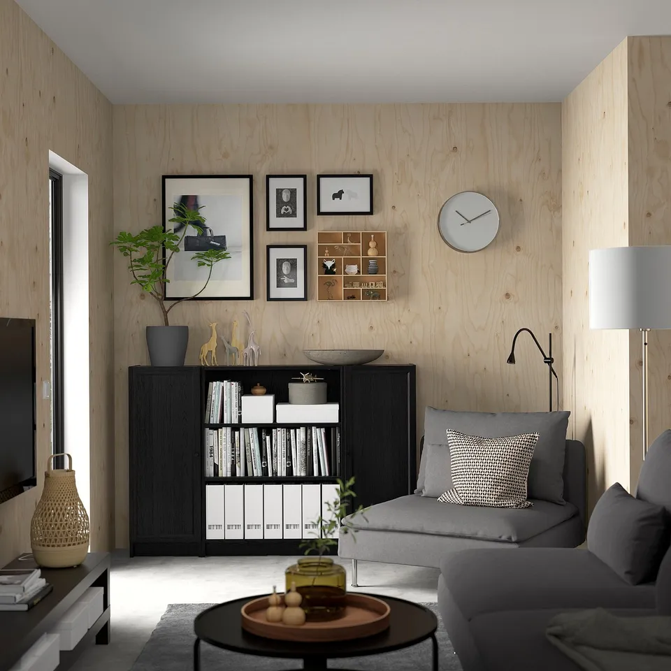 Modern living room with BILLY bookcase, sofa, tv, and coffee table.