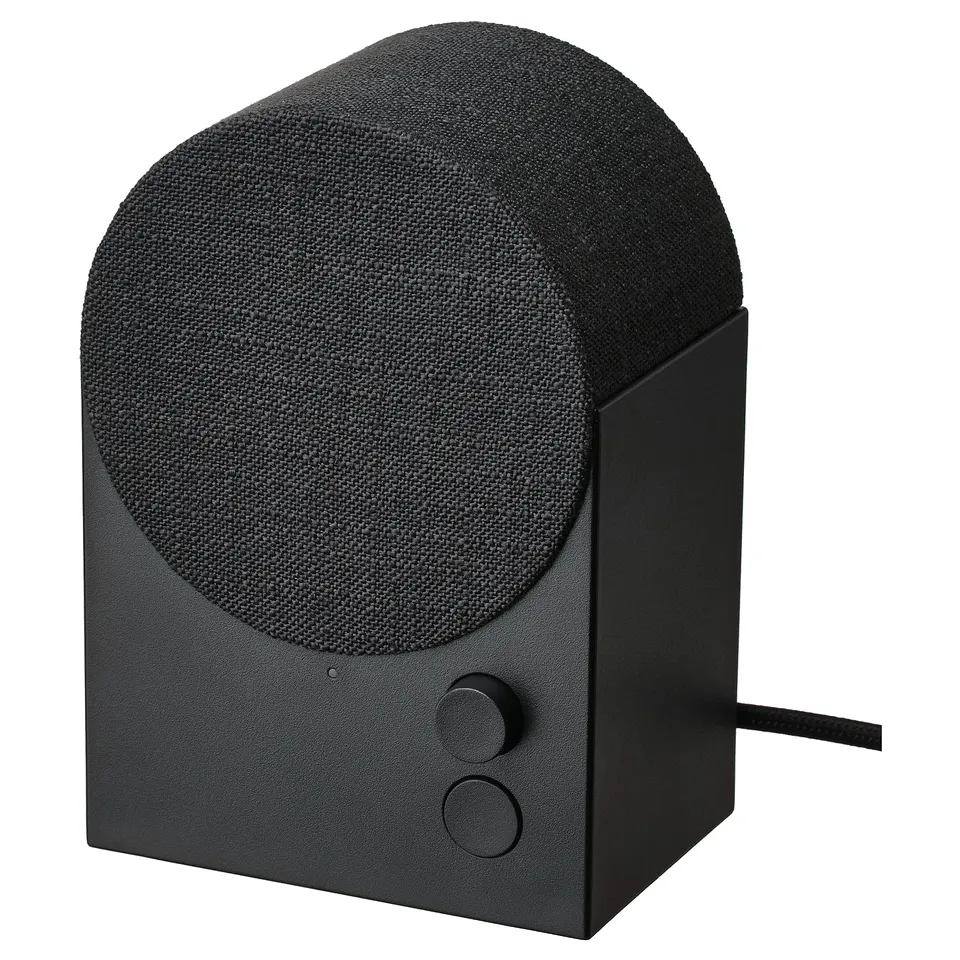 NATTBAD black speaker, cylindrical with fabric cover, touch controls.