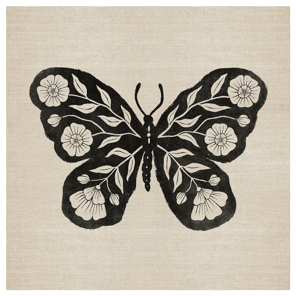 A GRÖNMES canvas print featuring a black butterfly with white floral designs on its wings. The natural beige background gives it a rustic look.