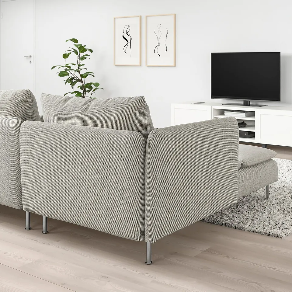 Modern living room with SÖDERHAMN grey sofa, tv, and plant.