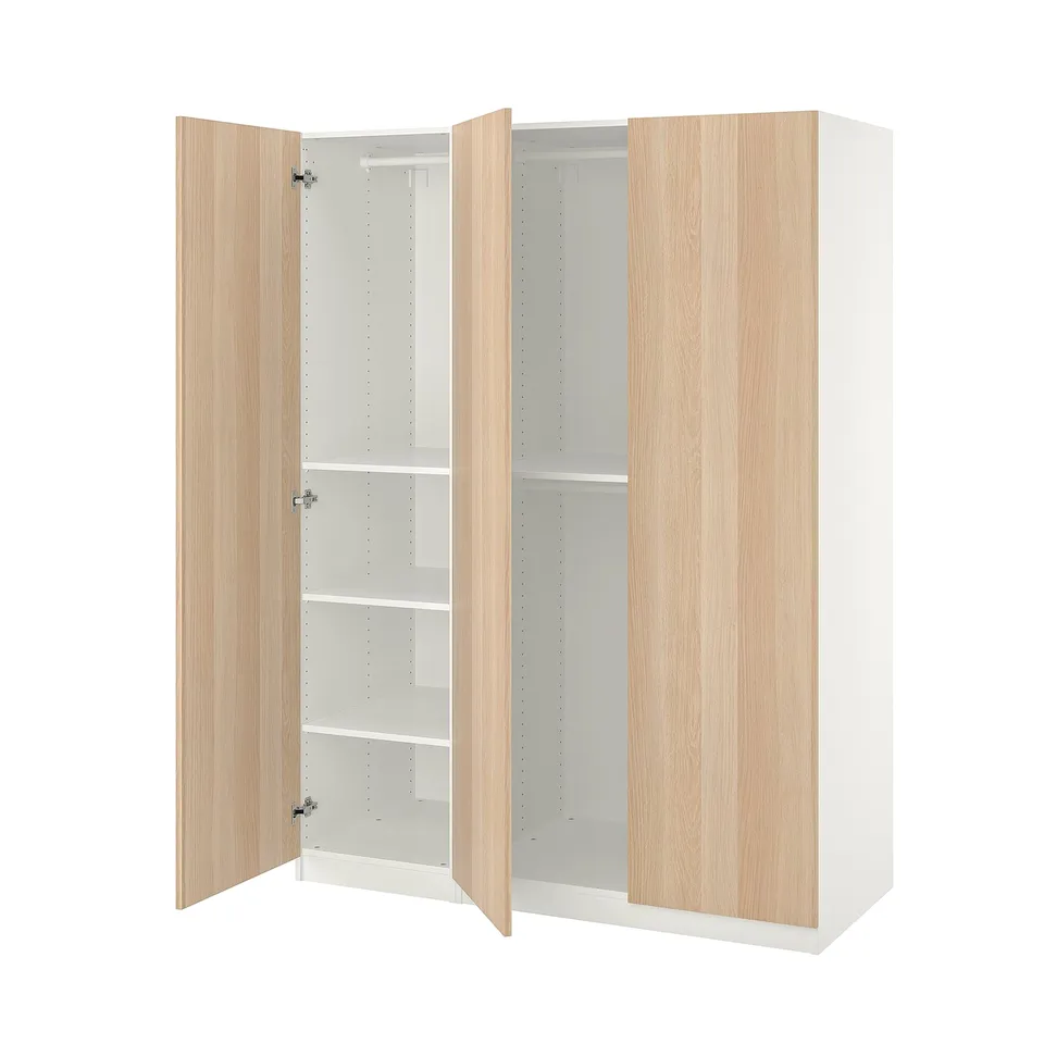White PAX wardrobe with light wooden doors, adjustable shelves, and soft closing hinges.