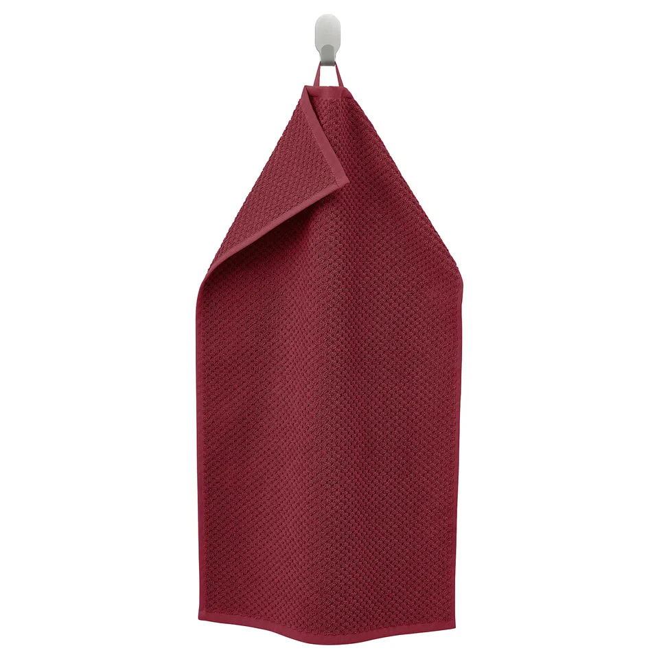 GULVIAL red towel hanging, thick, textured, folded neatly, metal hook, 100% cotton.