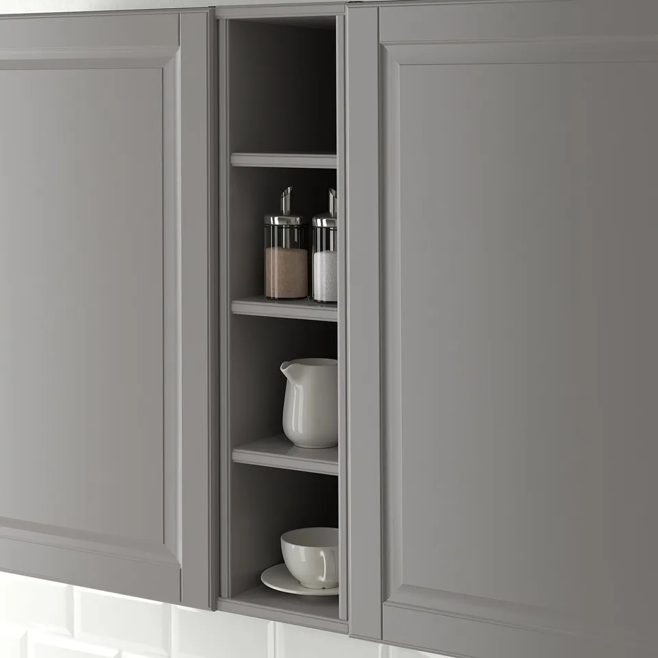 Open kitchen cabinet displaying kitchenware, part of the TORNVIKEN series.