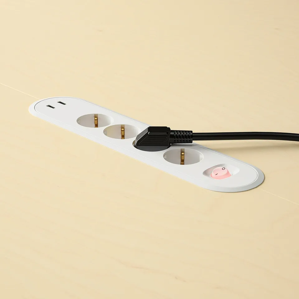 A white conference table with built-in power sockets and usb ports, featuring cable management and a round design for small group discussions.