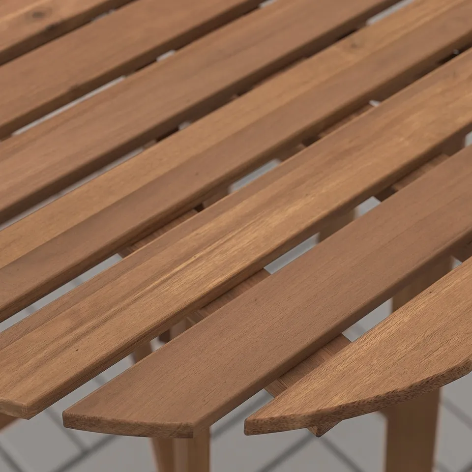 Wooden outdoor table with slatted design, finely polished and arranged in a diagonal pattern, showing high-quality craftsmanship.
