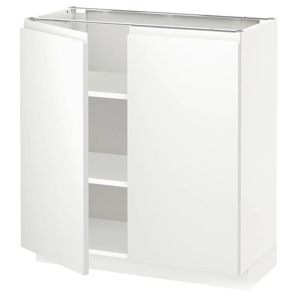 White kitchen cabinet with one open door, two shelves inside, no visible handles.
