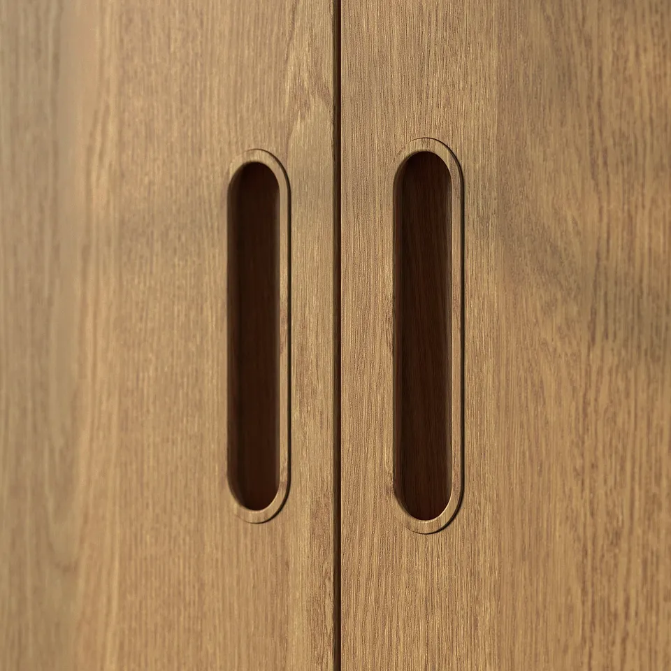 Oak cabinet with dark handles.