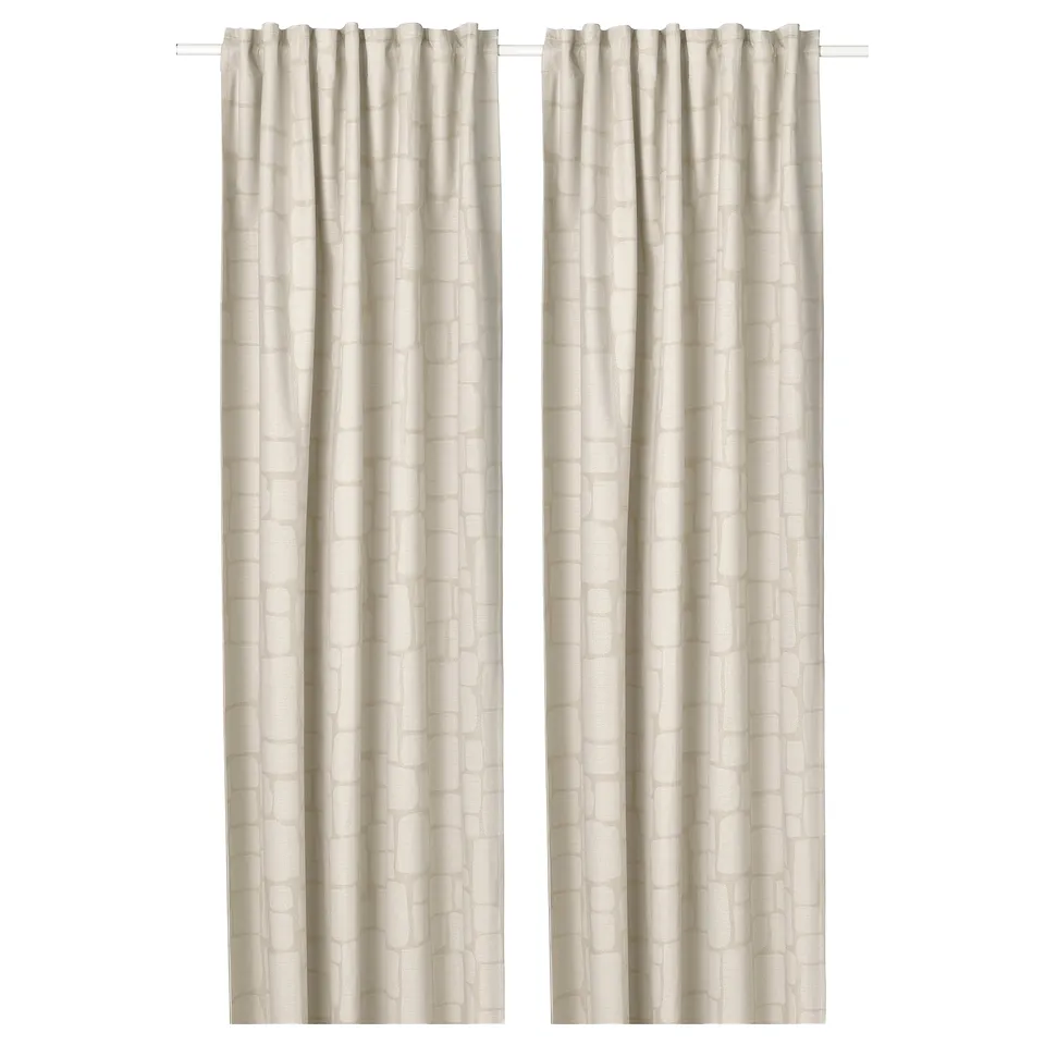 Beige LÖNNSTÄVMAL curtains, jacquard-woven, block-out, with heading tape for easy hanging.