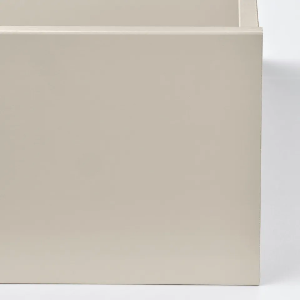 Flowering drawer front, smooth paper foil finish. Used in minimalist wardrobe space, light grey, neat appearance.