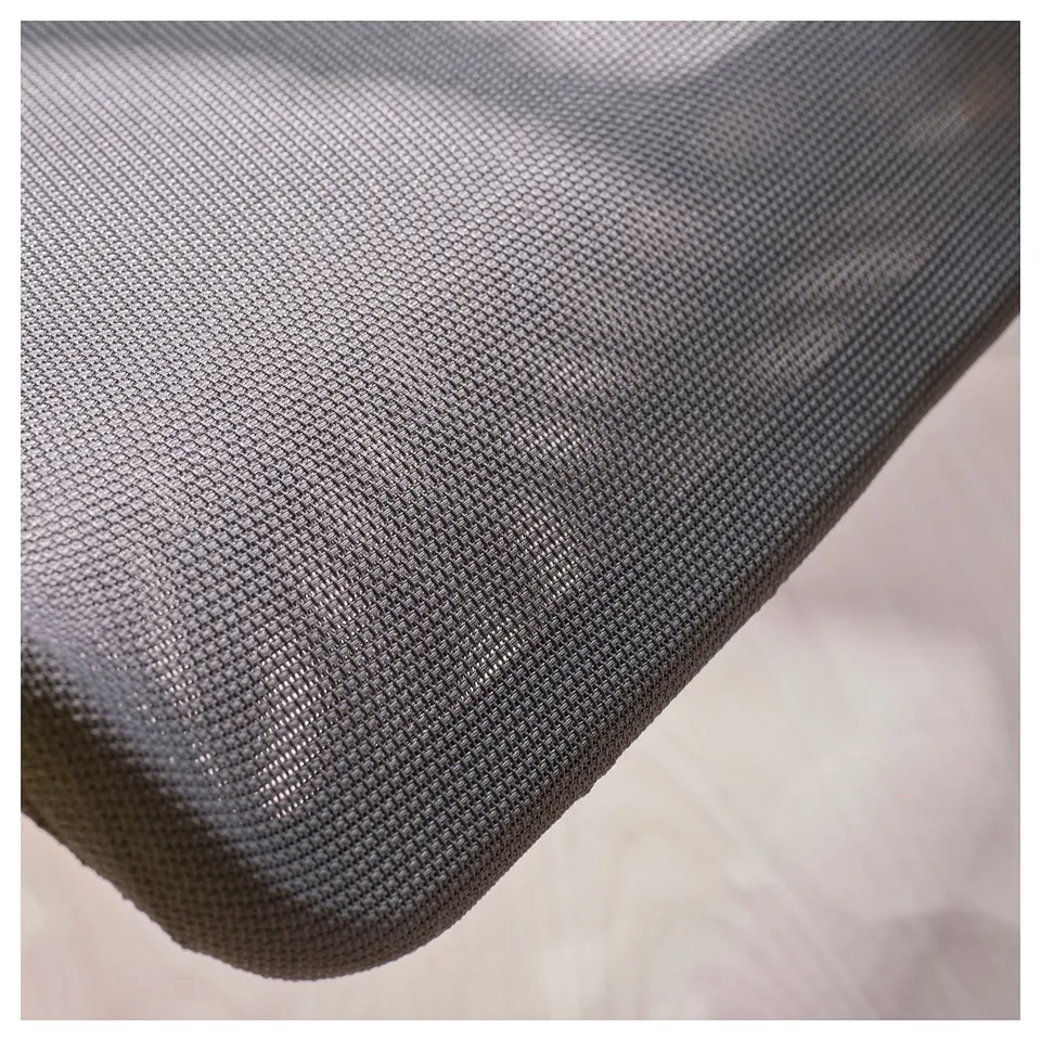Close-up of breathable mesh on gaming chair for comfort and durability.