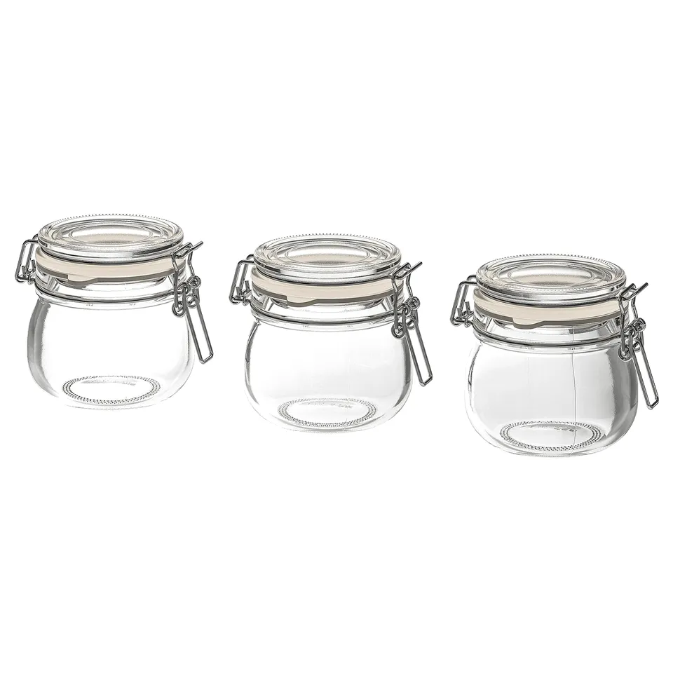 Three clear glass jars with silver clamps and rubber seals, arranged side by side, part of the KORKEN series.