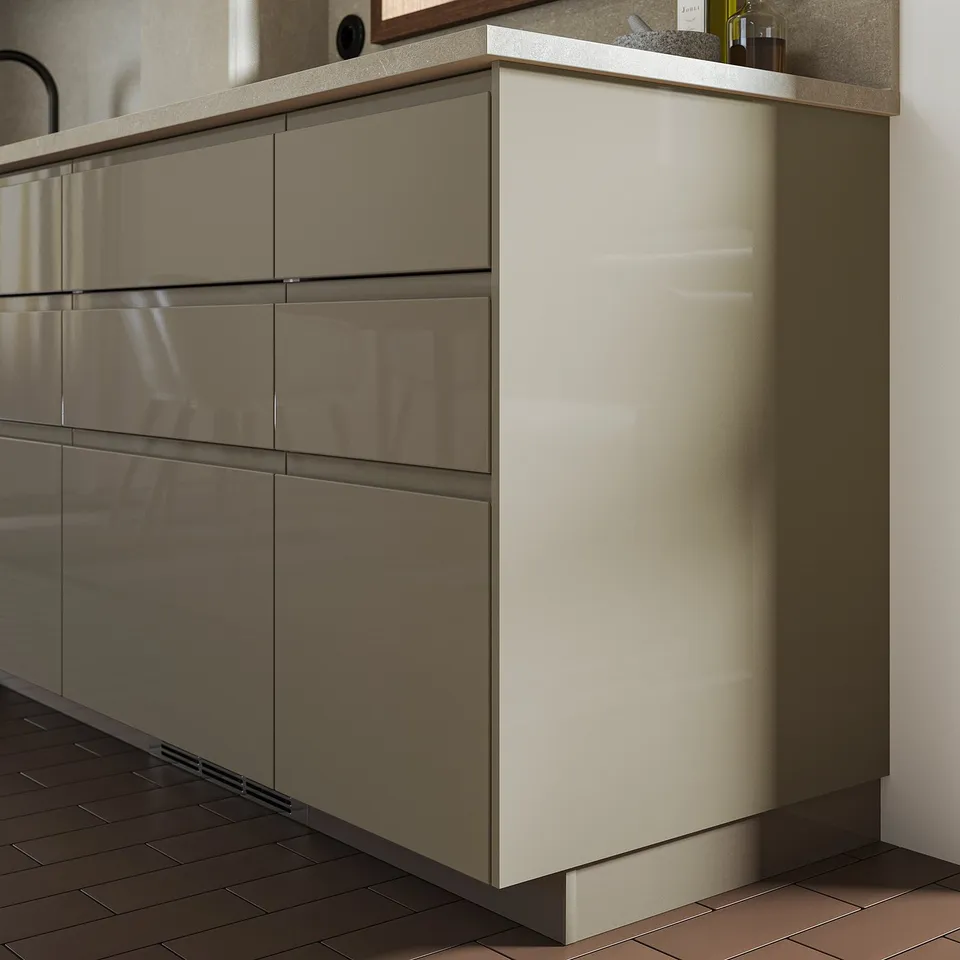 VOXTORP cabinets in cream with high-gloss finish, sleek modern design.