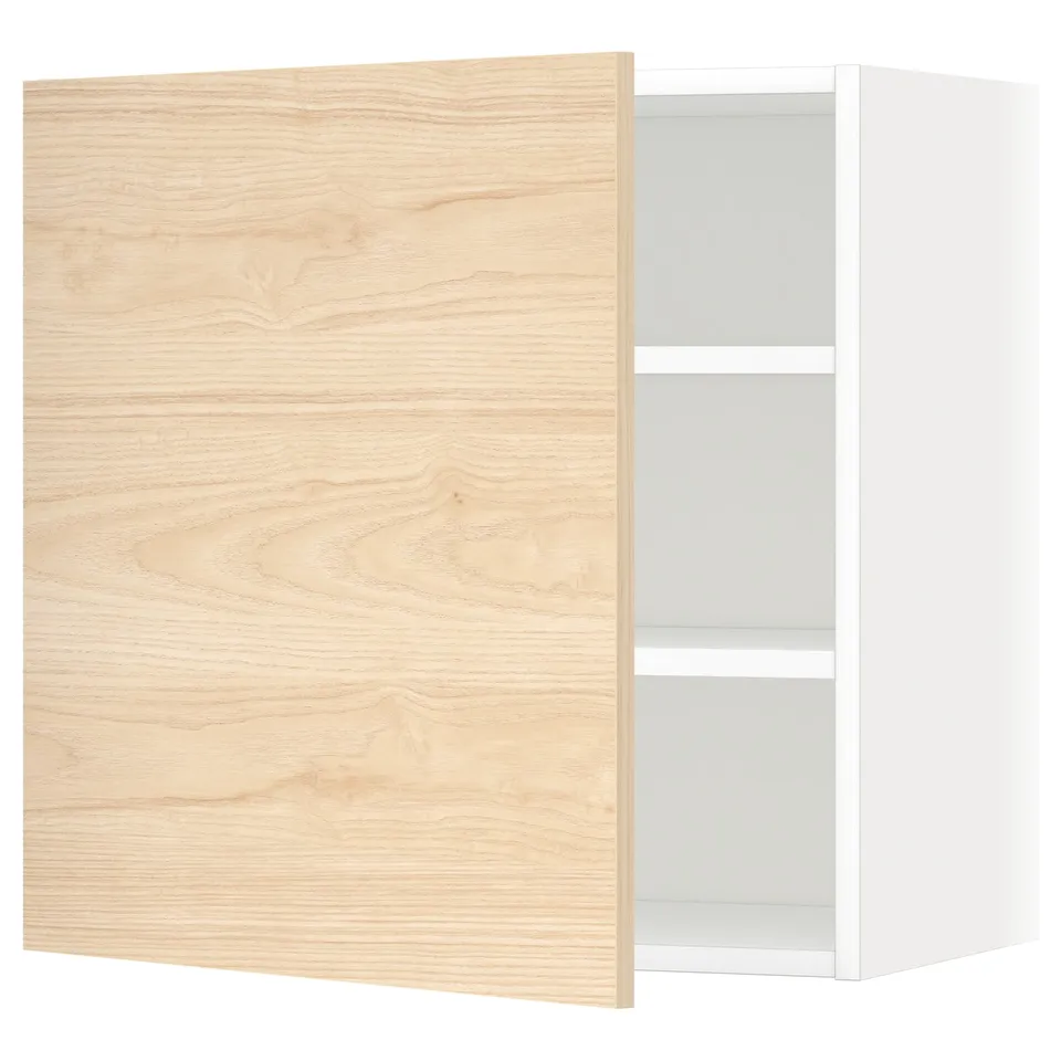 A light oak-colored cabinet with a wooden texture, part of the METOD kitchen system, showcasing a single door and adjustable shelves inside.