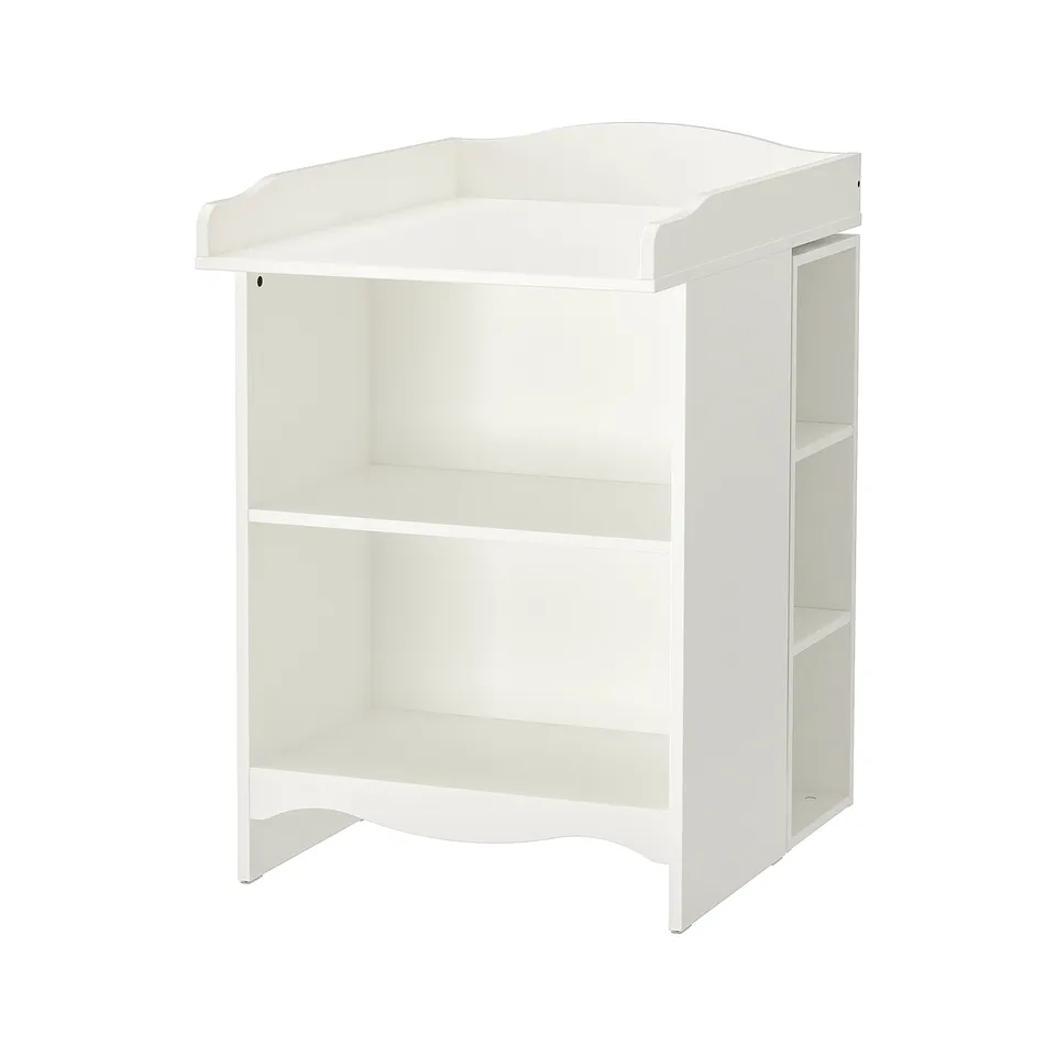 White ikea SMÅGÖRAs changing table with storage shelves.