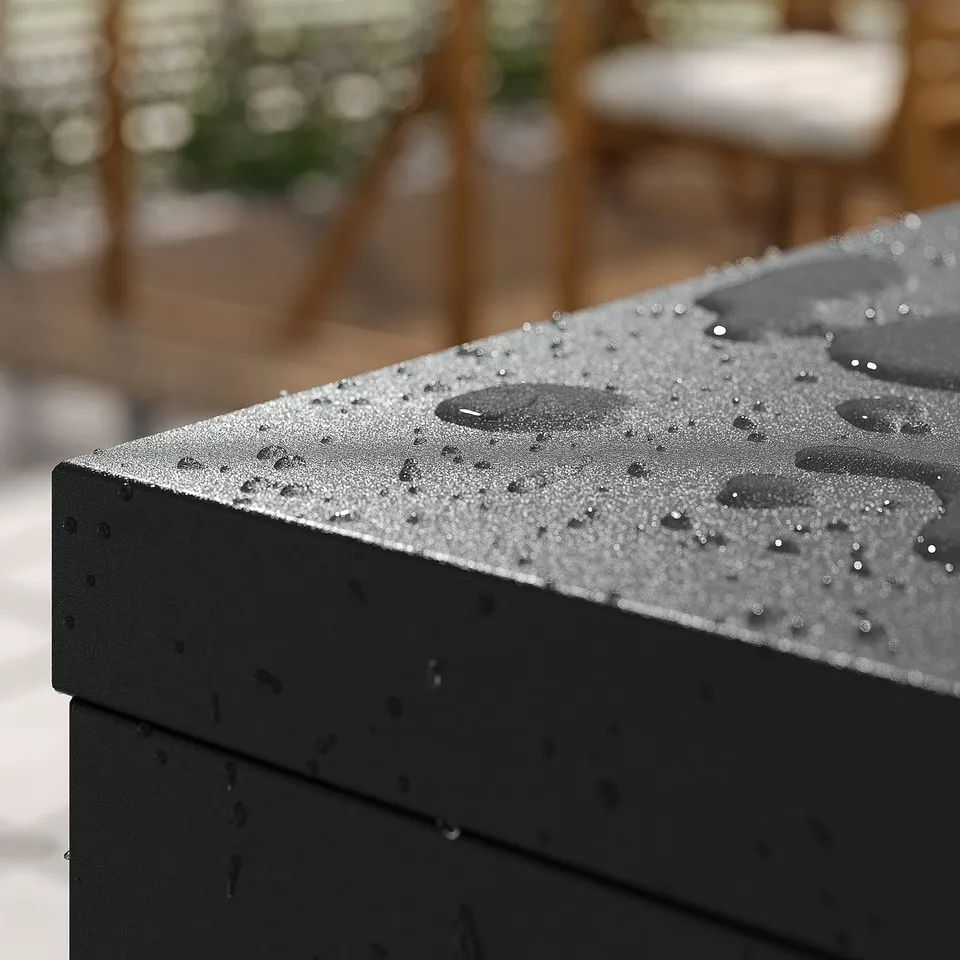 Black metal cabinet with rain droplets, suitable indoors or outdoors.