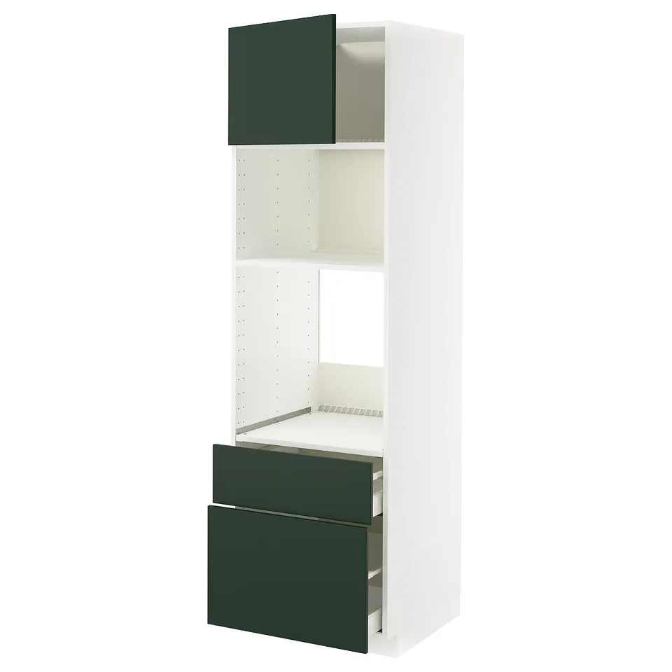 White METOD kitchen unit with green drawers and shelves.