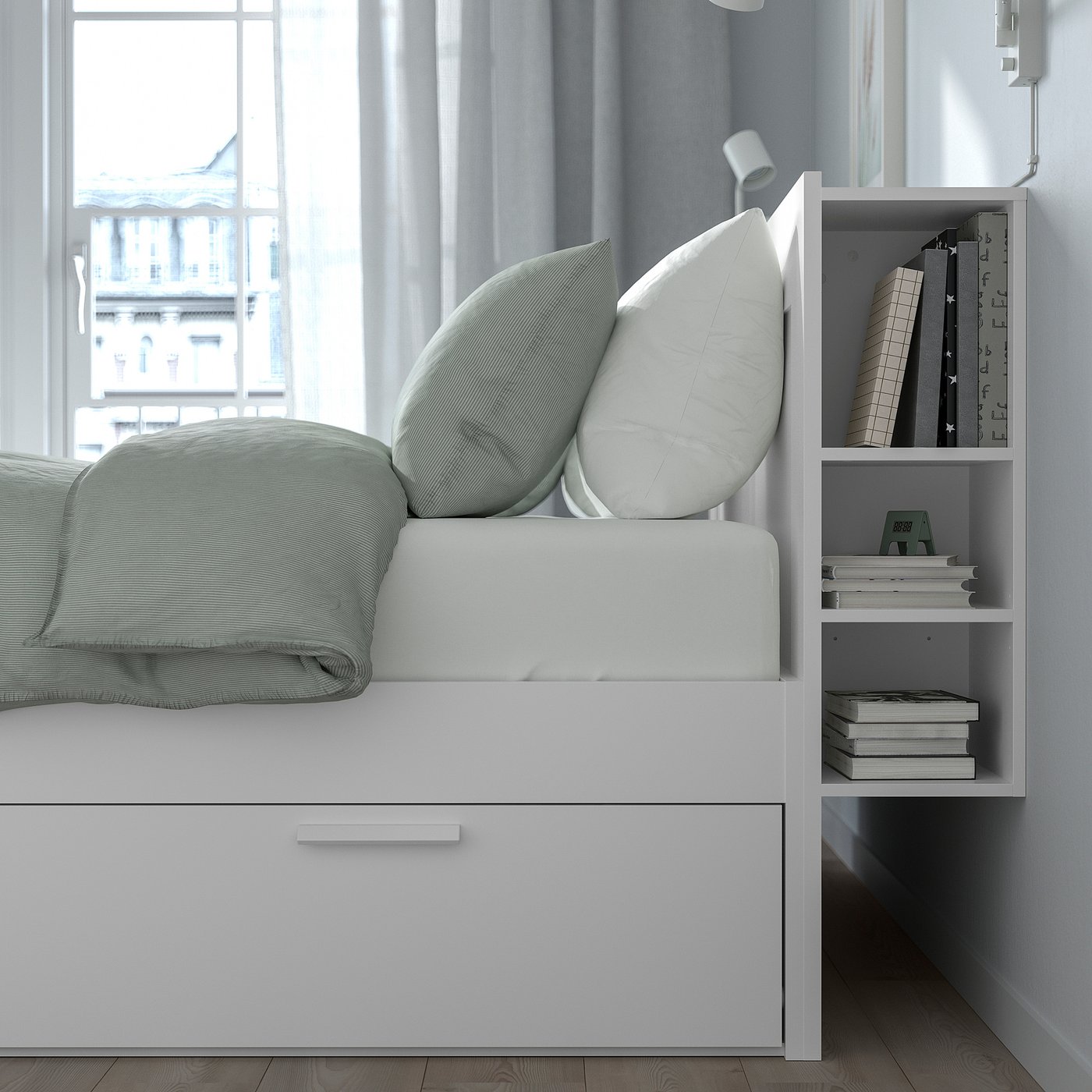 Modern bed with built-in storage, ideal for small spaces. White frame, light green accents, hidden storage.