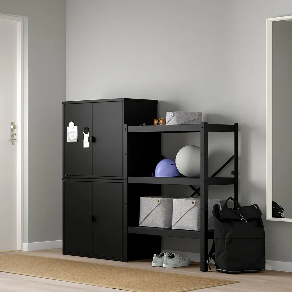 Black BROR storage unit with 2 cabinets and open shelves holding items.