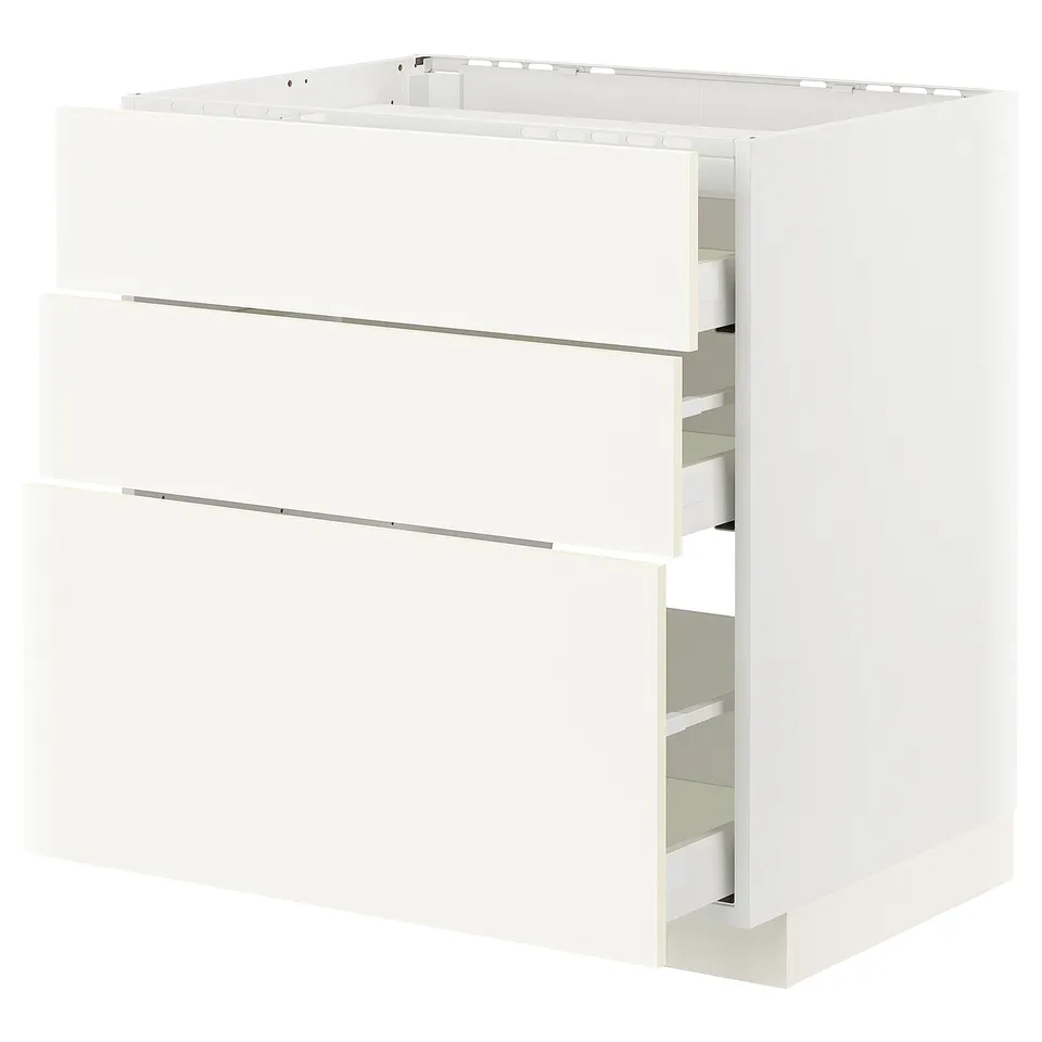 A white METOD kitchen cabinet with three full-extension drawers in a sleek, modern design.