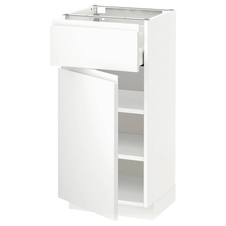 A white METOD kitchen cabinet with a single drawer and an open compartment, featuring minimalist design.