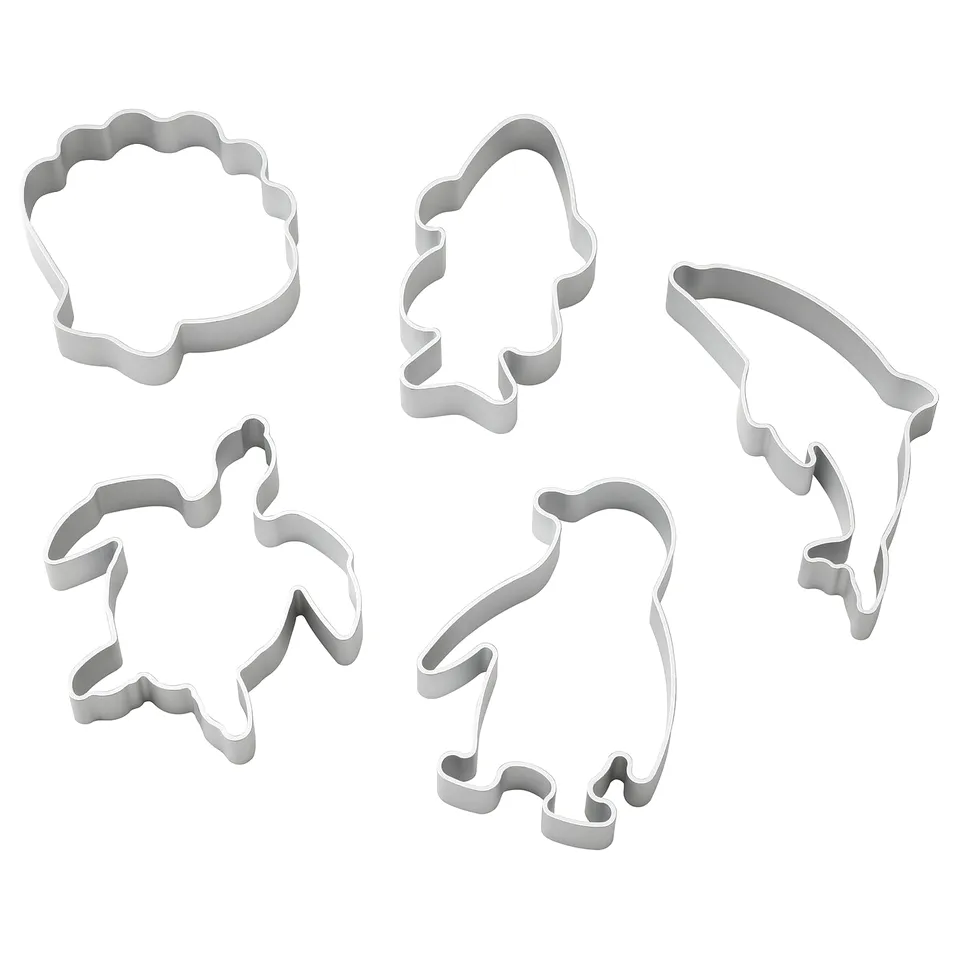 Five silver cookie cutters in shapes of turtle, fish, clam, dolphin, and penguin, designed for kids.
