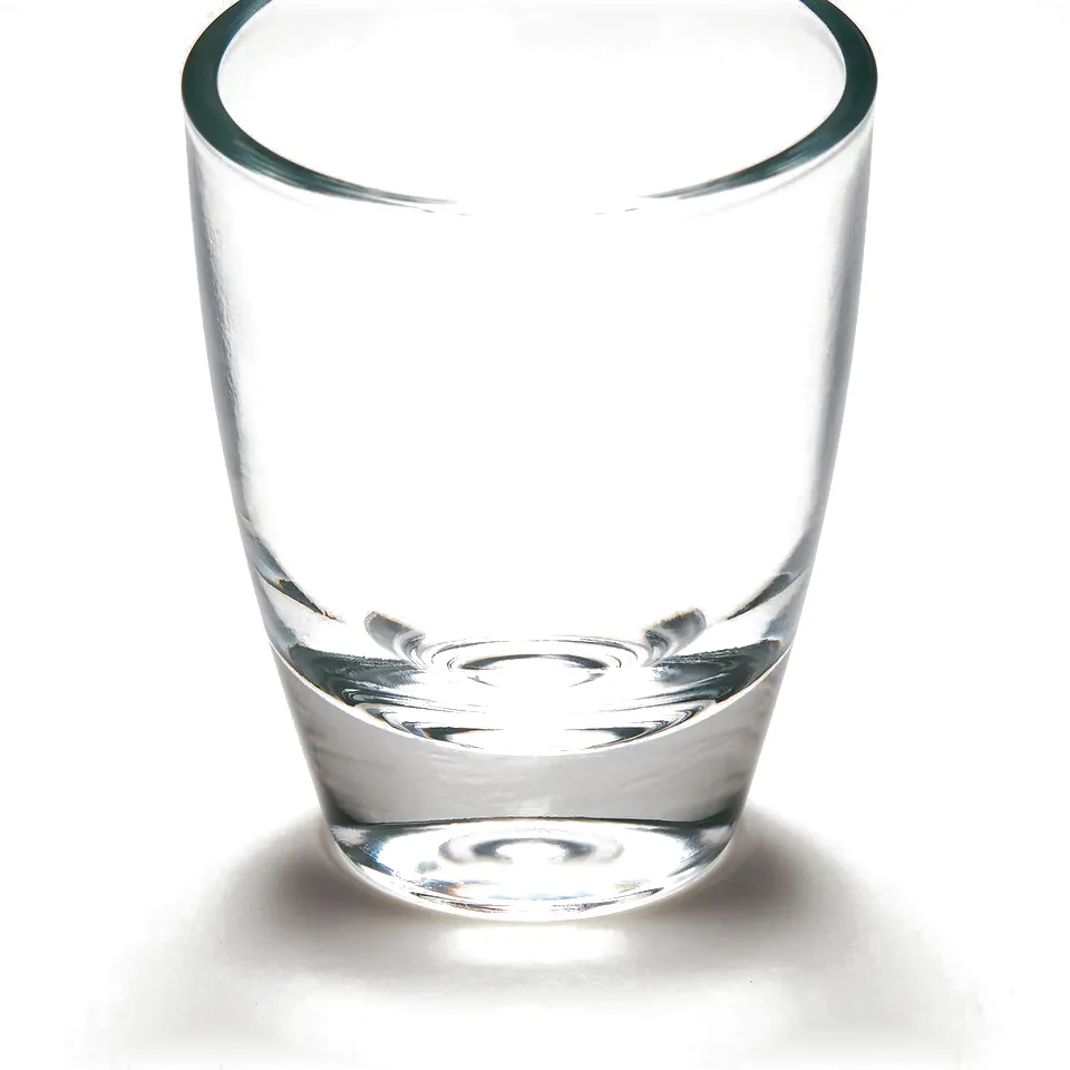 Small, clear glass, well-made, stands firmly, ideal for shots.