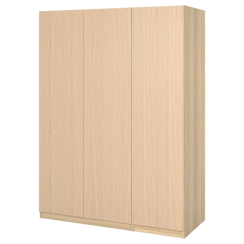 Light coloured wooden wardrobe, rectangular shape, smooth finish, with four flat panels and two doors.