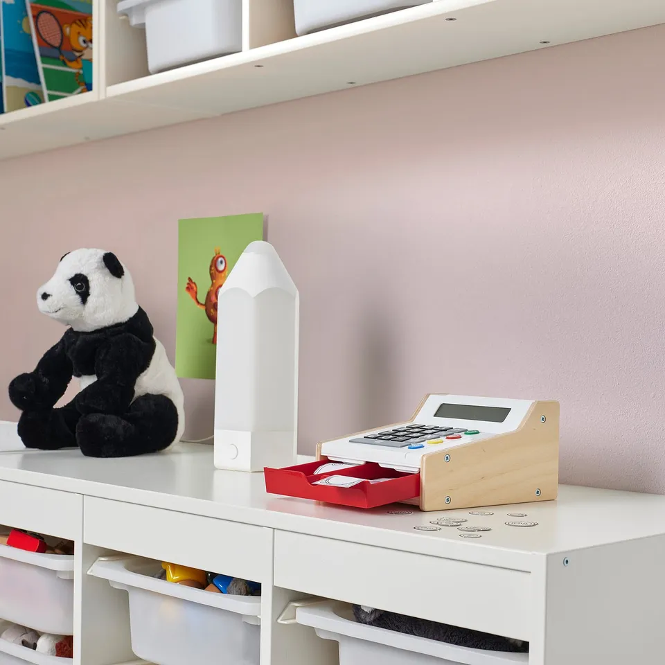Toy cash register DUKTIG with panda on desk.