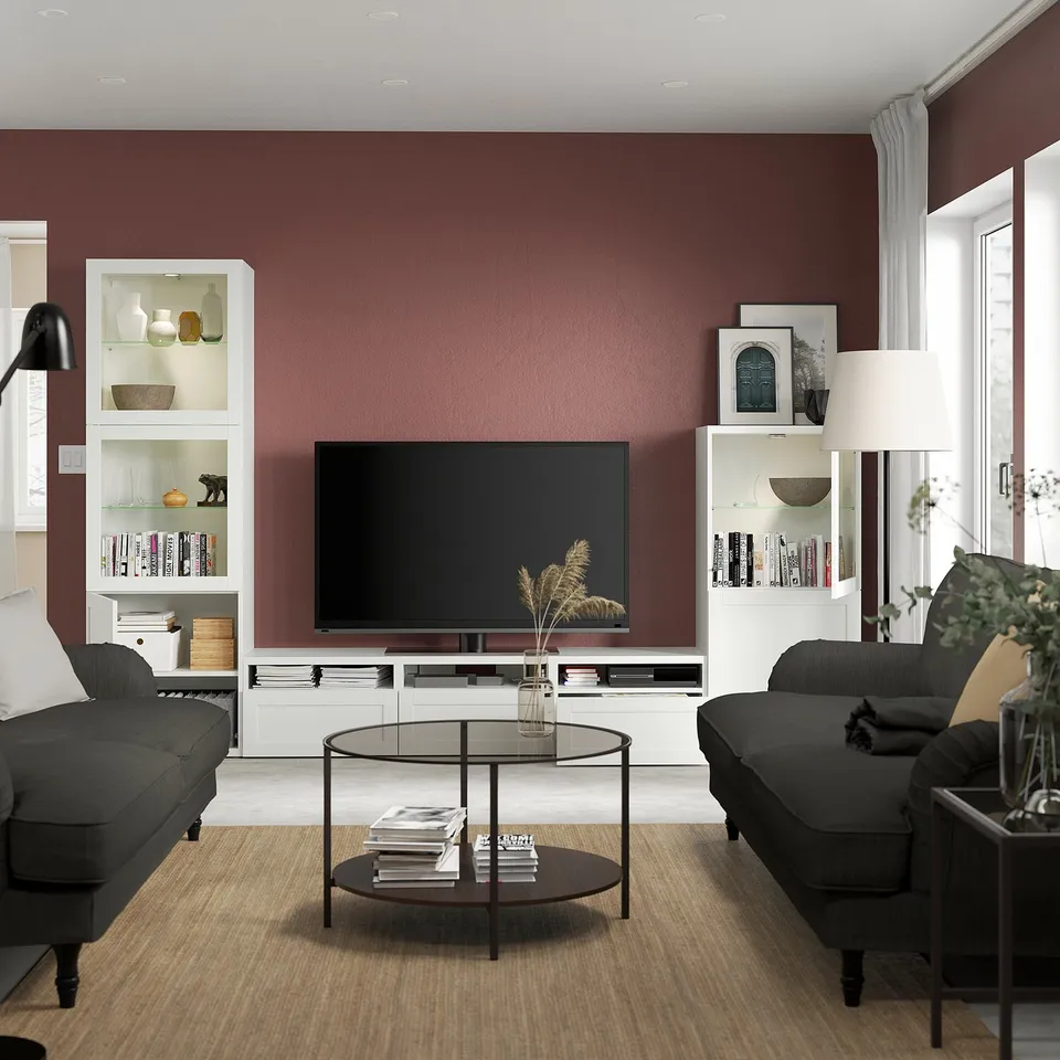 Modern living room with BESTÅ tv unit and built-in bookcases.