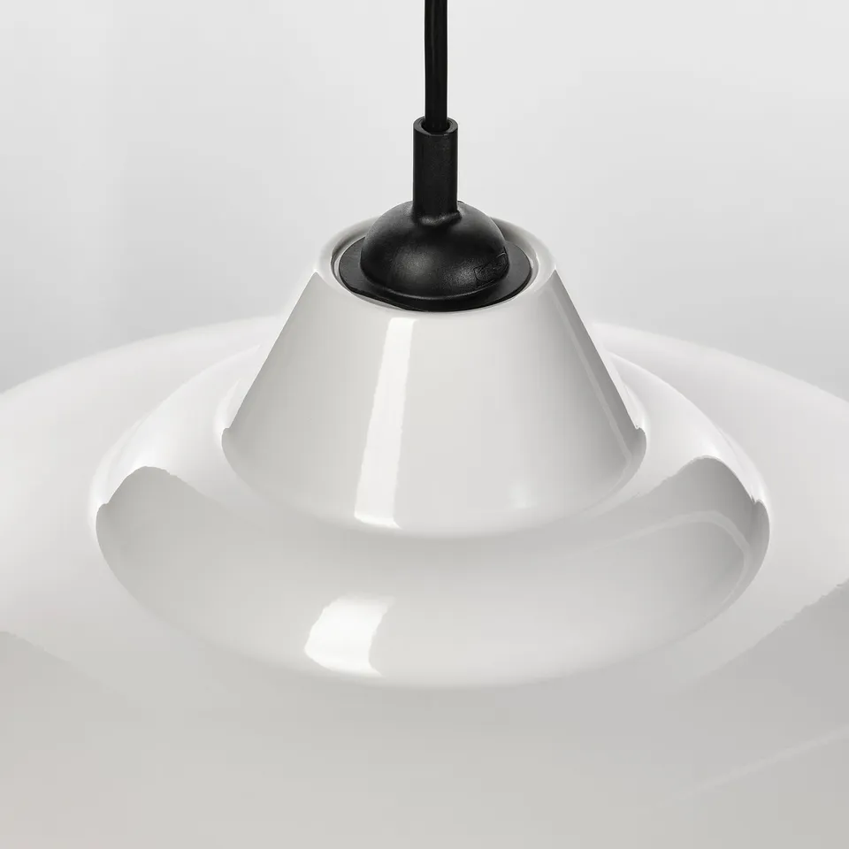 Modern hanging lamp with high-gloss white shade and sleek black rod, offering directed light.