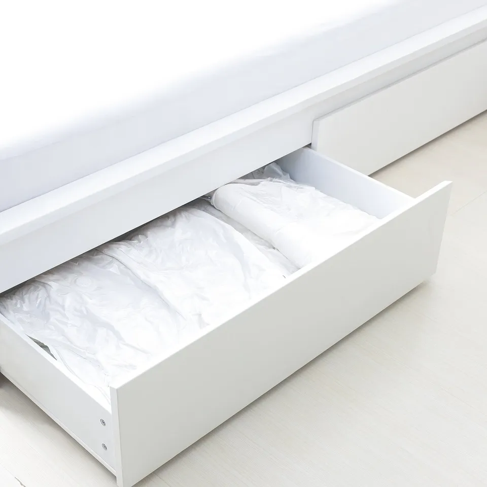 White SPANTAD vacuum bag drawer organiser, compact and minimalist design.