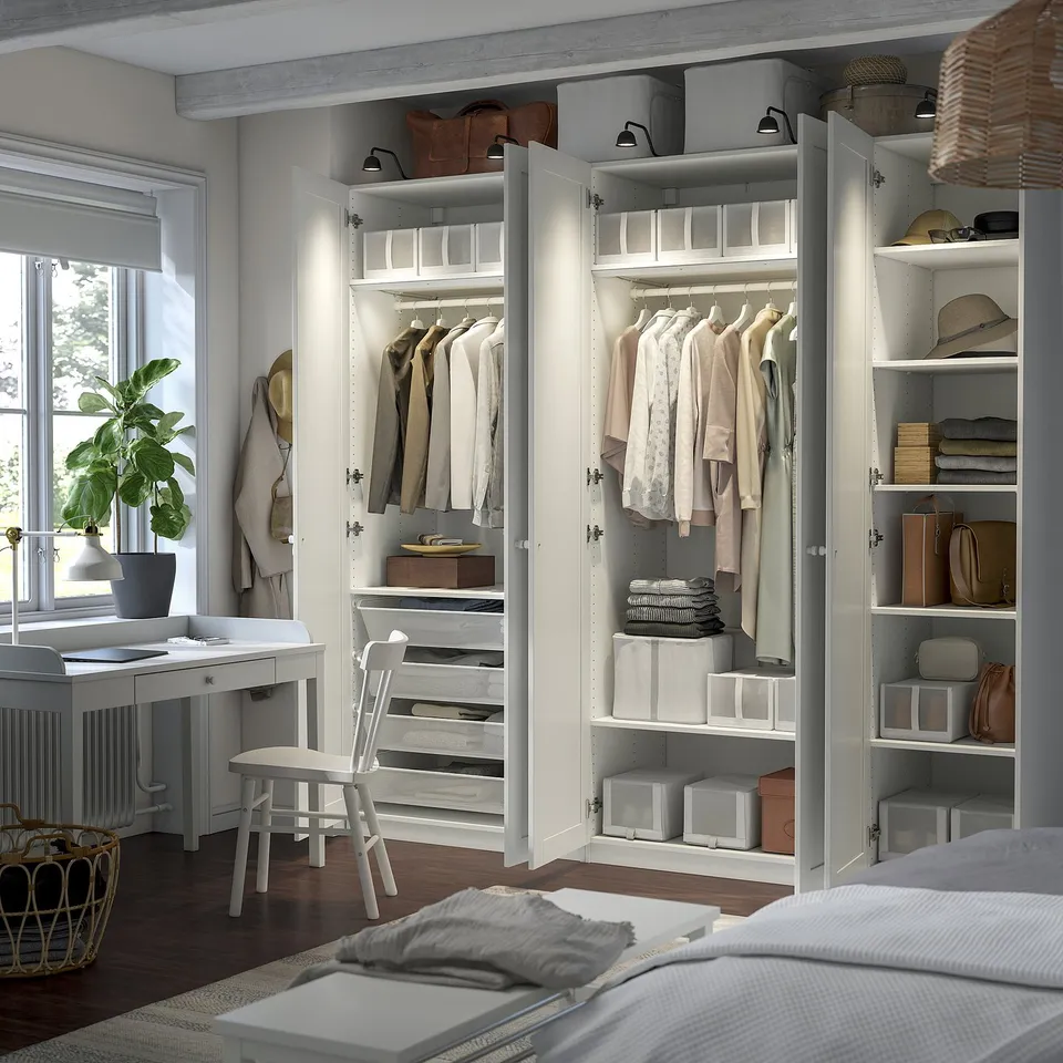 A well-organized wardrobe with shelves and drawers displaying neatly folded clothes and accessories.