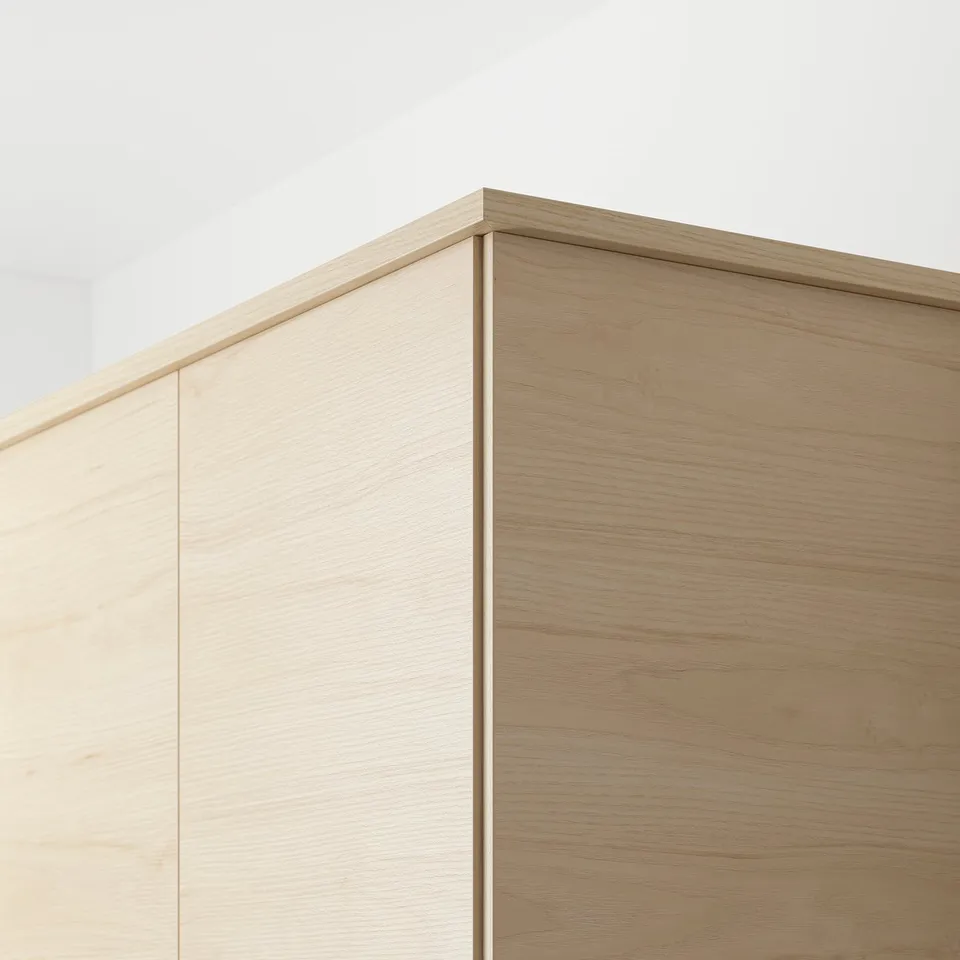 Image shows light wood cabinet detail, highlighting easy-clean surface and sturdy design.