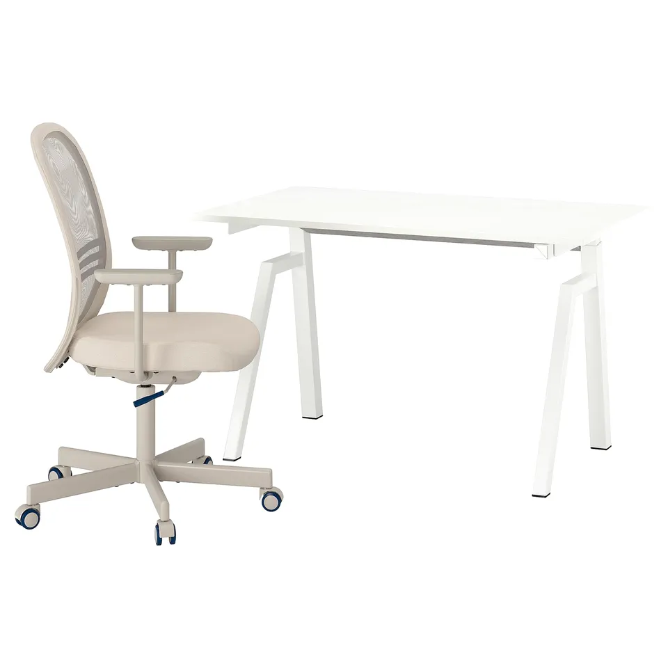 A white trottén desk and chair. The desk has a square top and four thin legs. The chair is ergonomic with a mesh back and beige upholstery.