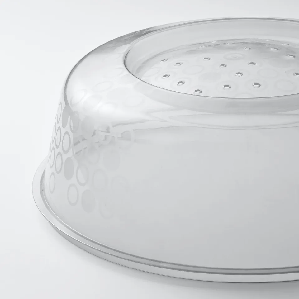 Translucent plastic cover with small holes for steam release, designed for microwaves.