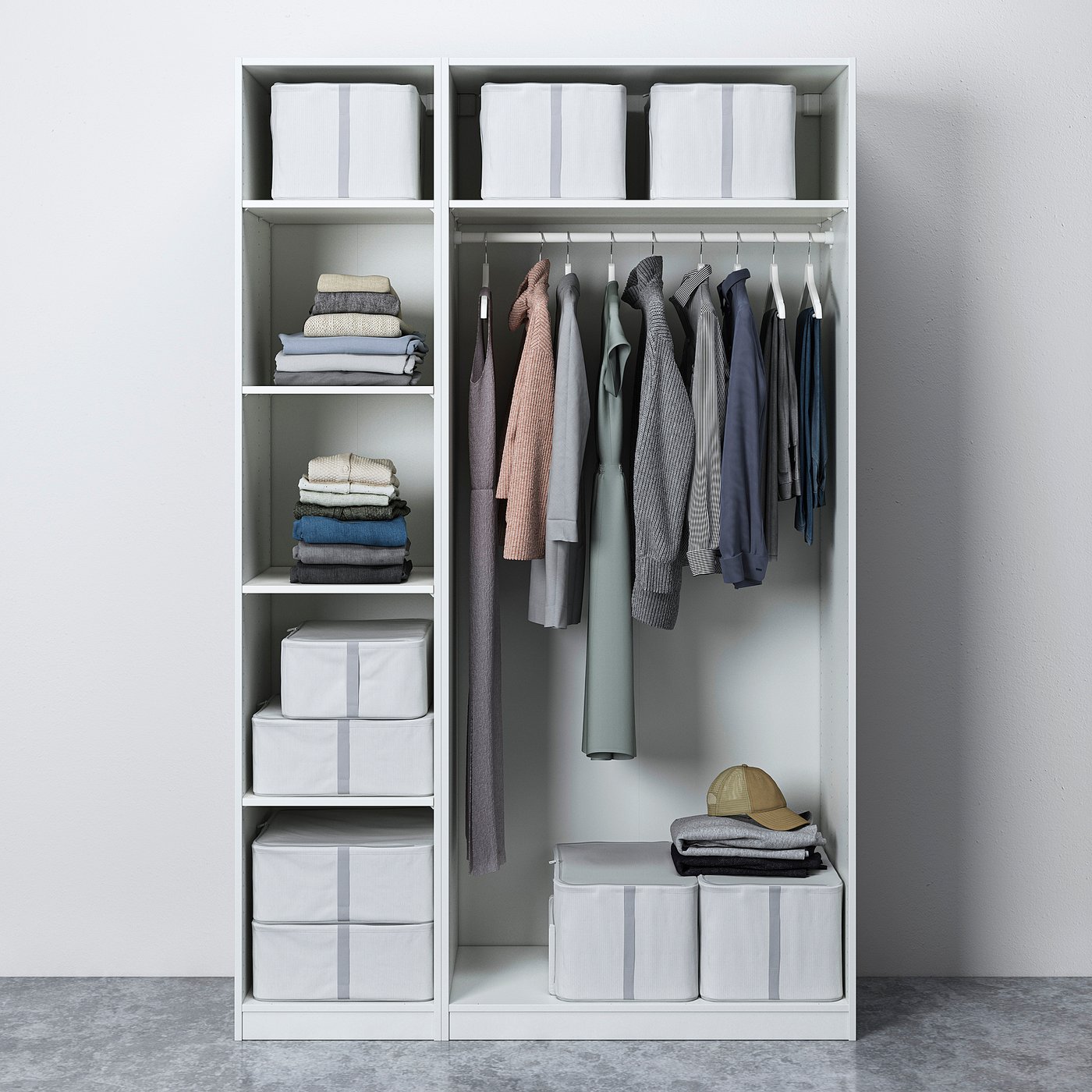 Modern closet with grey clothes, folded stacks, and striped boxes on white shelves.