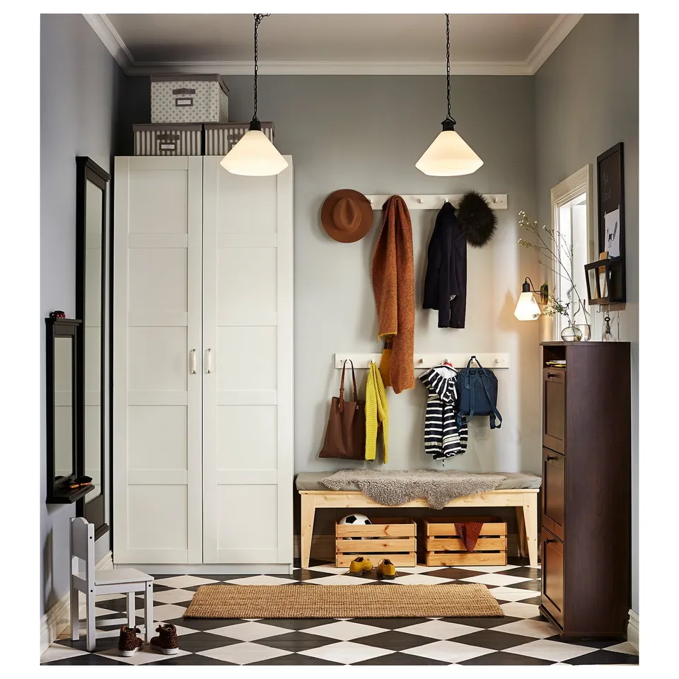 White PAX wardrobe, chequered floor, coats, hats, bags, bench with storage, two pendant lights.