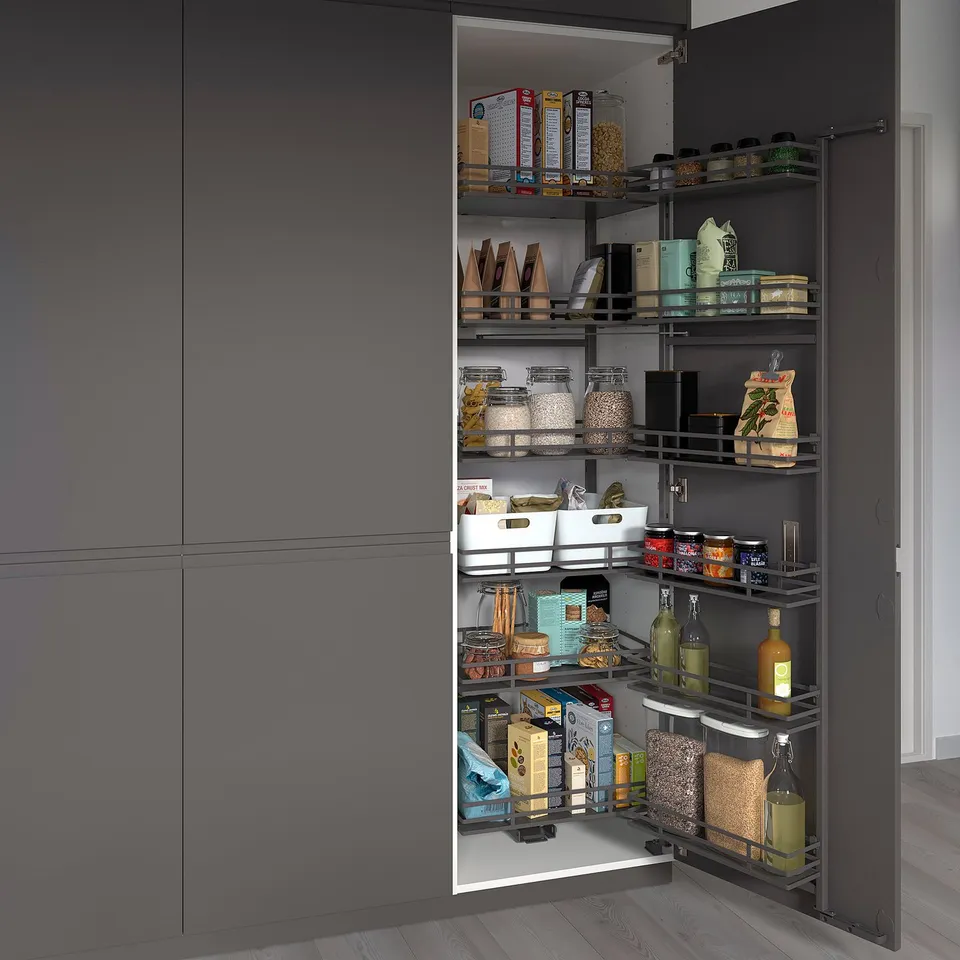 Well-organized kitchen pantry with pull-out shelves, displaying various food items, jars, and boxes for easy access.