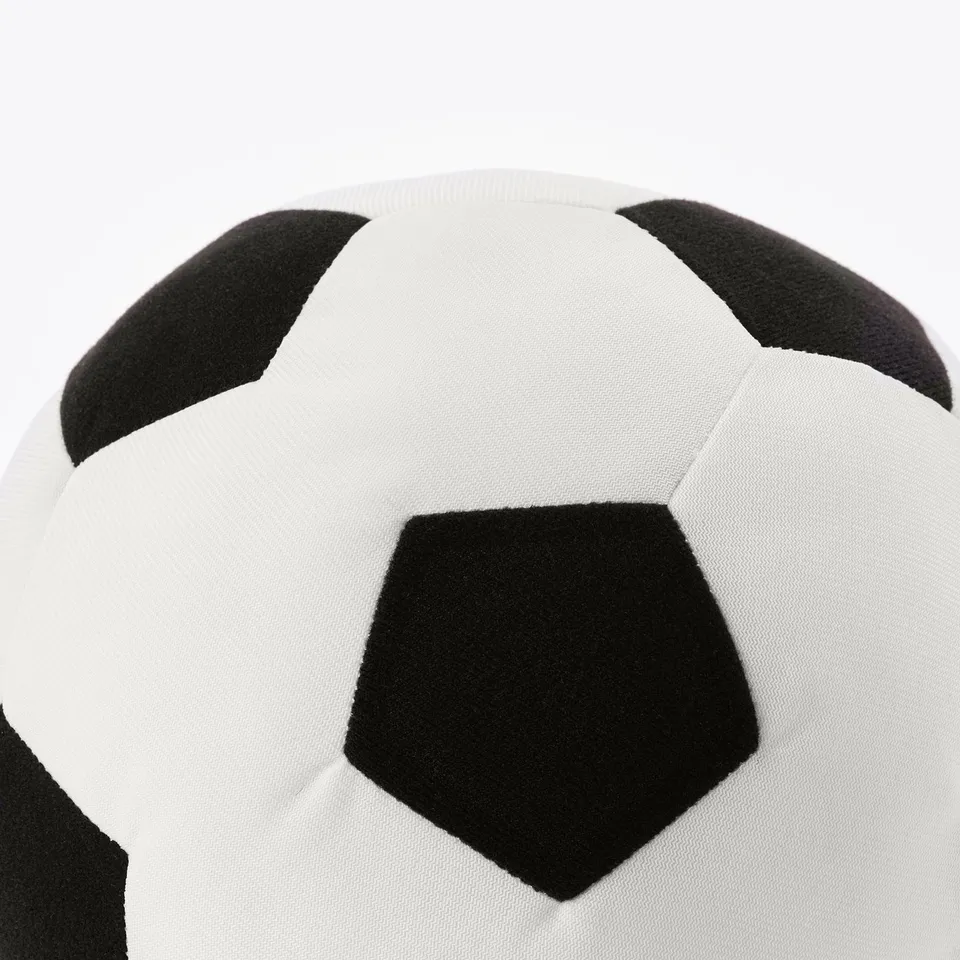 Black and white soft-textured football, perfect for indoor play, contrasting pentagons and hexagons seen clearly.
