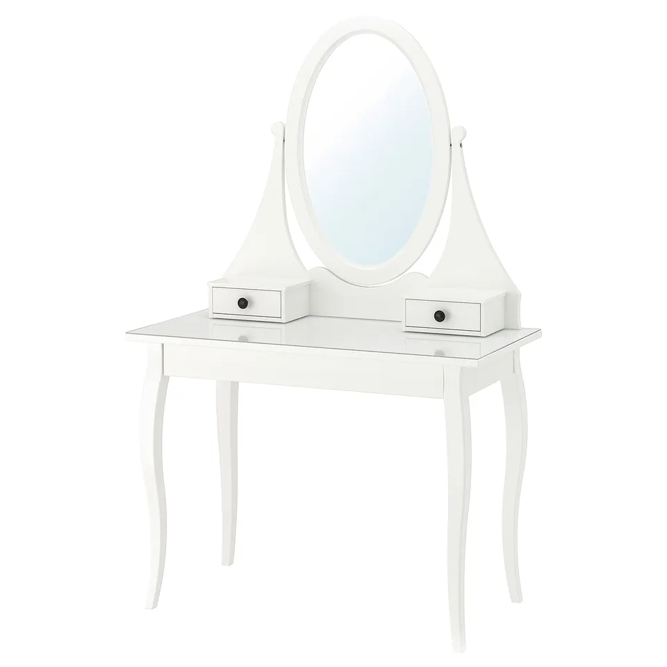 A white HEMNES vanity with glass top, featuring an oval mirror and three drawers.