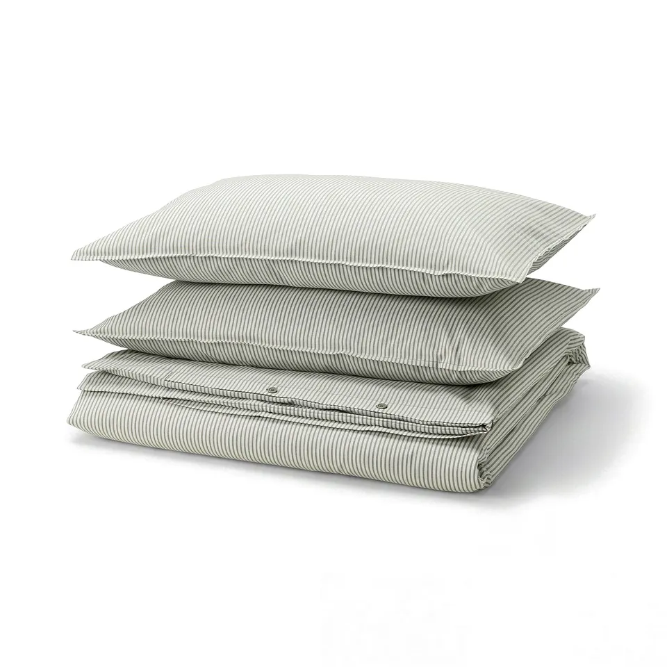 A stack of green and white striped SOLFIBBLA cotton duvet covers.