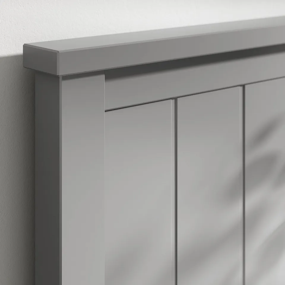 A close-up of a grey wooden bedroom furniture with smooth painted finish and clean edges.