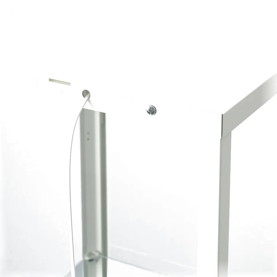 A white glass-door cabinet with a metal frame, featuring adjustable shelves and a visible metal fastener for wall attachment.